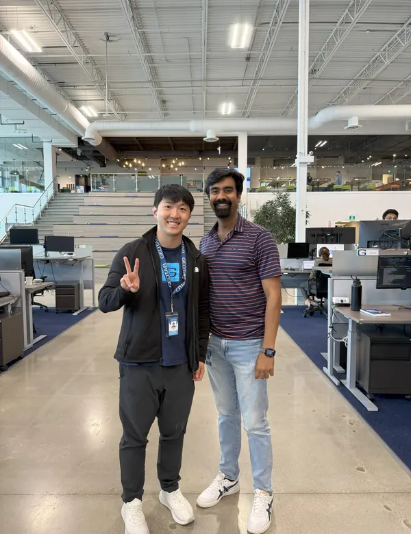 Hongda with his manager Varun in the office