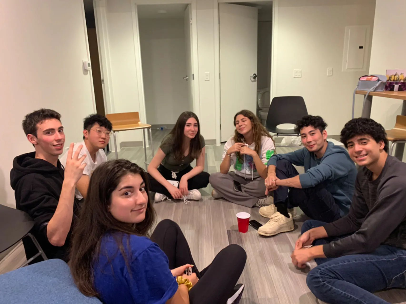 Friends sitting in a circle on the floor